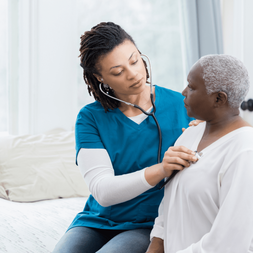 Caregiver checking on an older adult at home